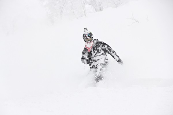 Darcy covered in fresh powder after a faceshot in the trees of Nozawa Onsen