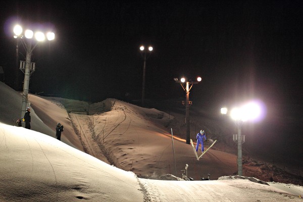 Locals practicing on the ski jump in the evening at Nozawa Onsen.